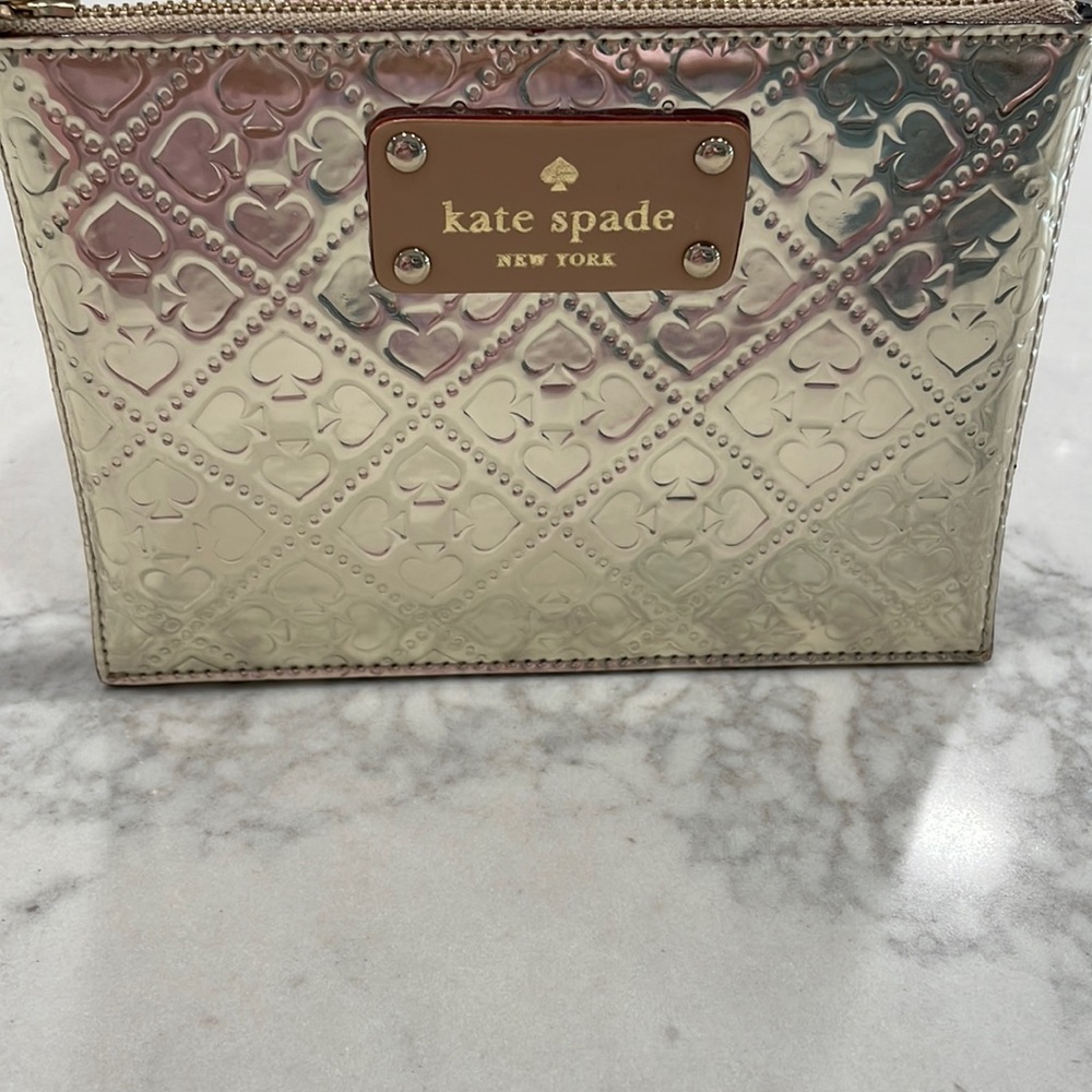 Mini gold clutch by Kate Spade